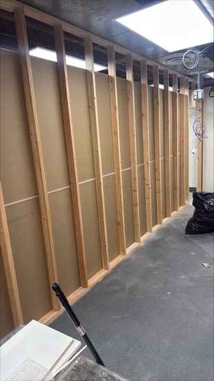 Interior wood stud wall framing during a commercial build-out
