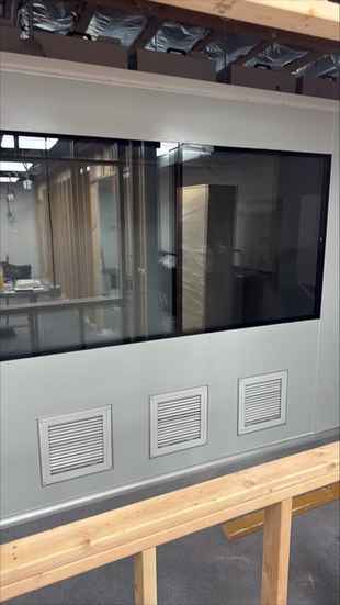 Modular wall panels with tinted observation window and ventilation louvers